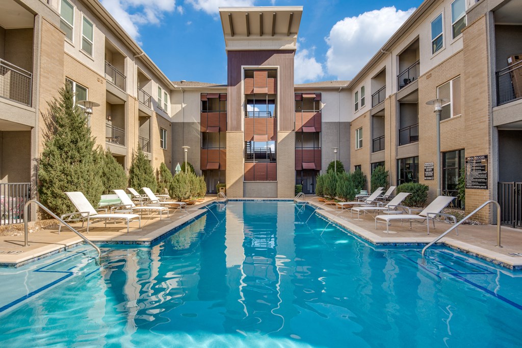our apartments have a large swimming pool with lounge chairs