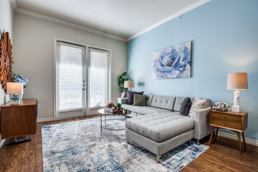 a living room with a couch and a table