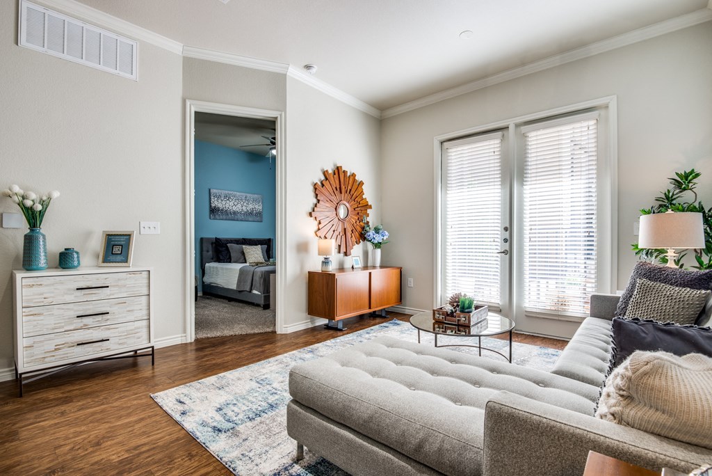 a living room with a couch and a large window