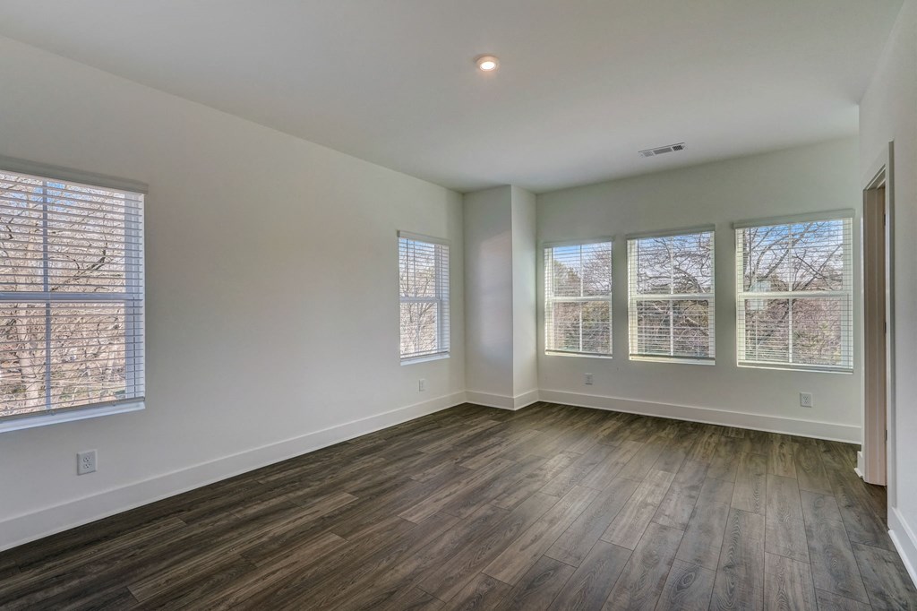 Henley Avondale Homes for rent in Avondale Estates, GA photo of the living room of a new home with wood flooring and windows