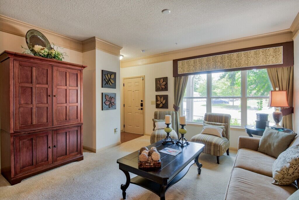 Hinesville, GA Apartments – Tattersall Village - living room with plush carpeting and large window