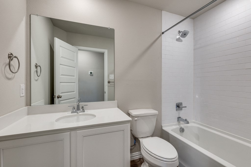 the preserve at ballantyne commons apartment bathroom with sink toilet and tub