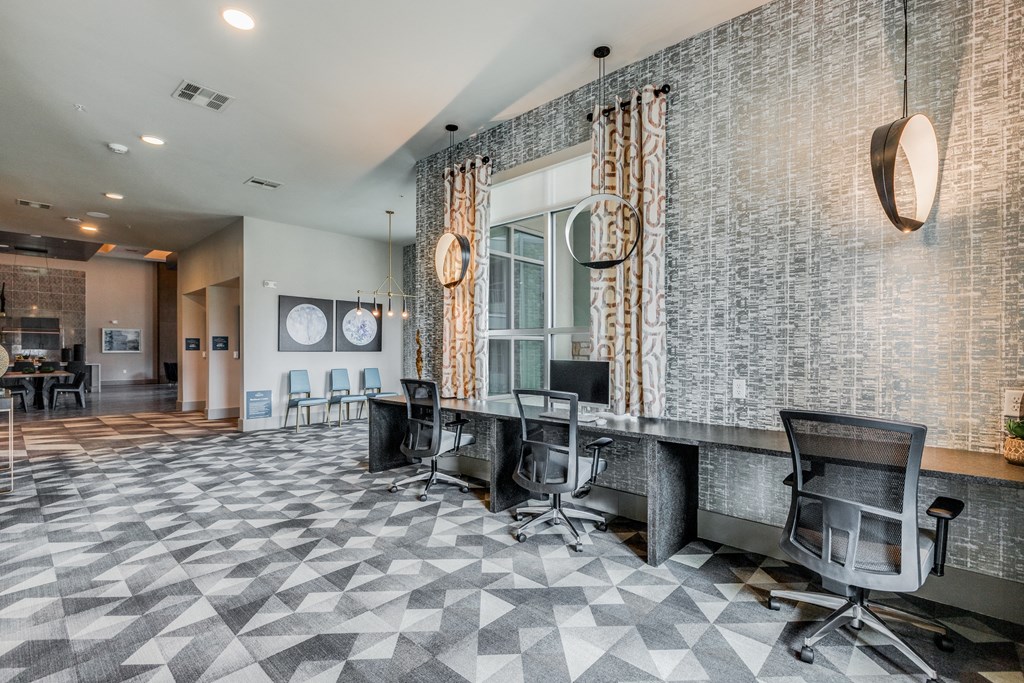 a conference room with desks and chairs and a large window