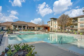 the preserve at ballantyne commons community swimming pool with apartment buildings