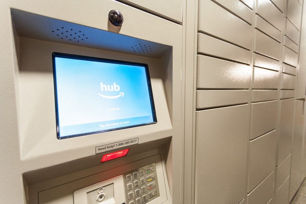 a kiosk with a computer screen on the side of a wall