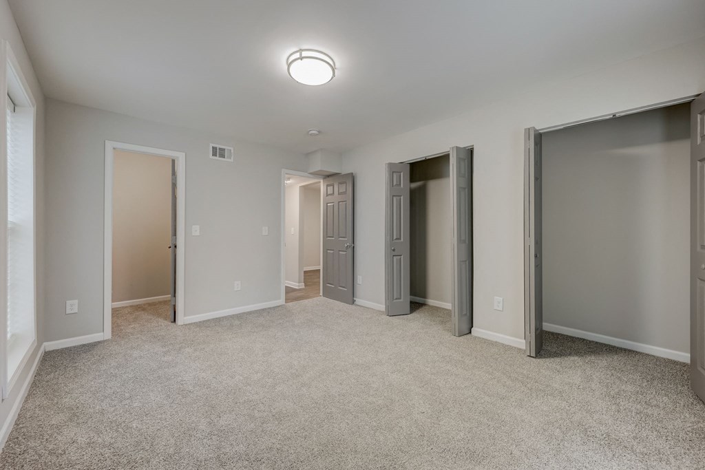 Apartments In Sandy Springs, GA for Rent – Celebration at Sandy Springs - a bedroom with plush carpeting and multiple closet space