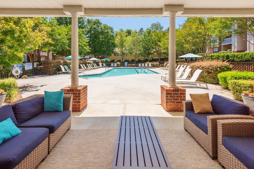 our apartments have a pool and a patio with furniture