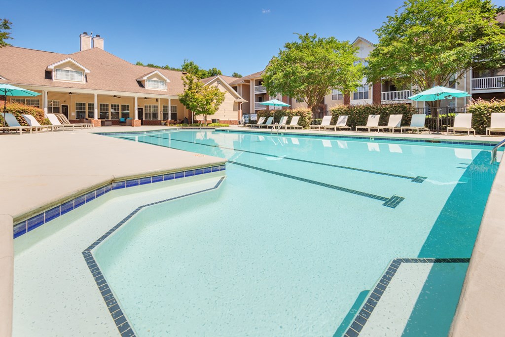our apartments offer a swimming pool with chairs and umbrellas