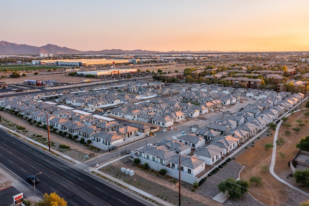 A suburban neighborhood with houses and a road.