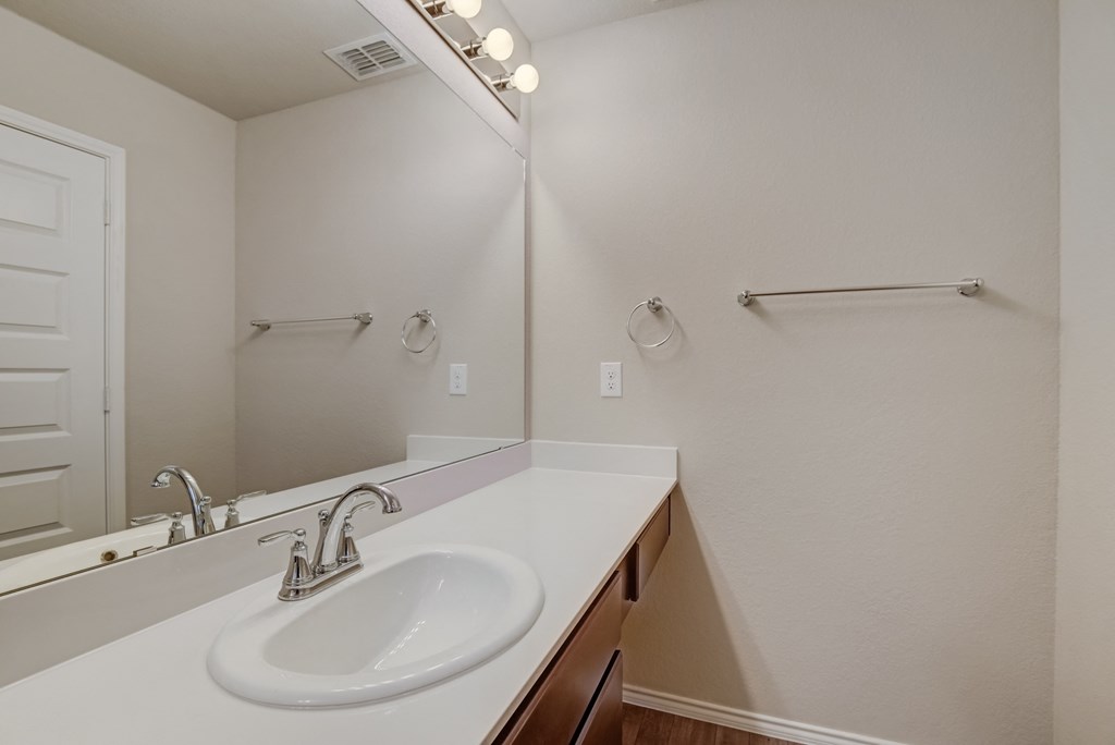 the preserve at ballantyne commons apartment bathroom with sink and mirror