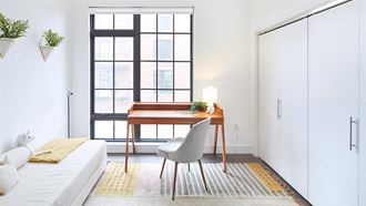Desk and chair against window in bedroom - Photo Gallery