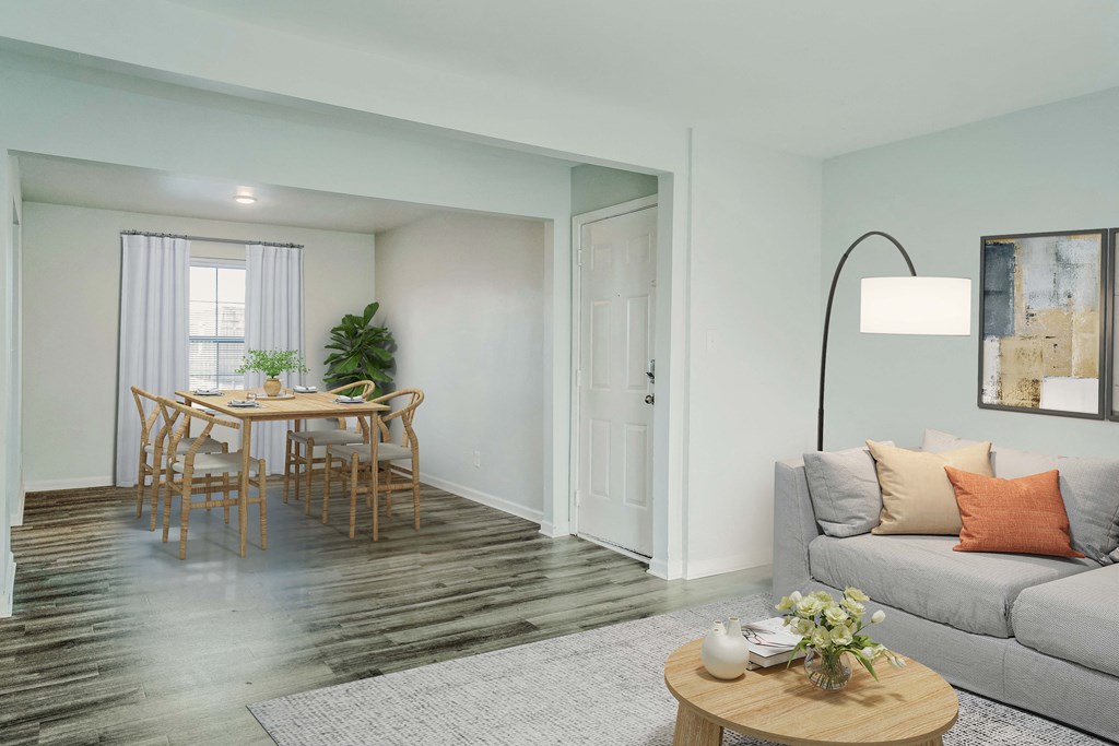 a living room with a couch and a dining room table