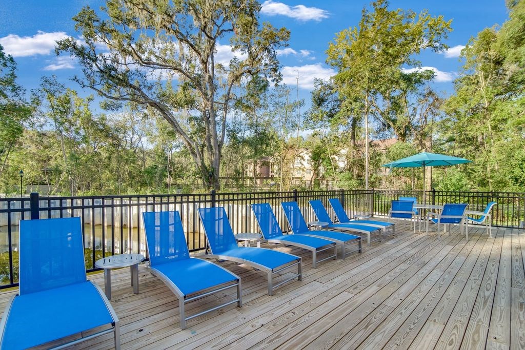 Pet-Friendly Apartments in Tallahassee, FL - Apalachee Point - Sundeck with Pool lounge chairs