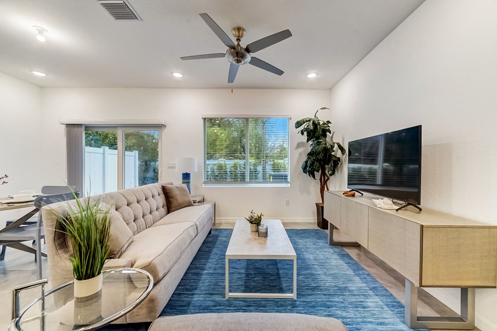 Boatman Hammock Townhomes in Lake Worth, FL photo of  a living room with a couch and a tv
