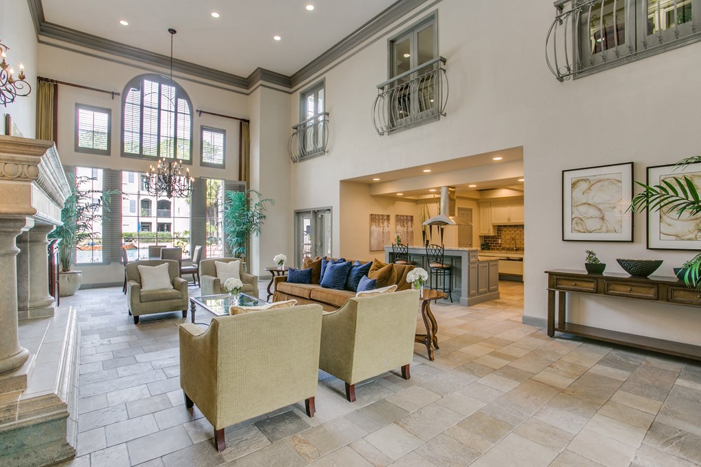 a living room with couches and chairs and a fireplace