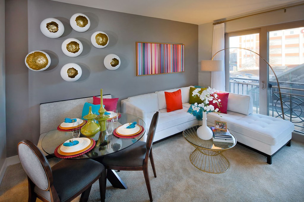 Living room with kitchen table and large window