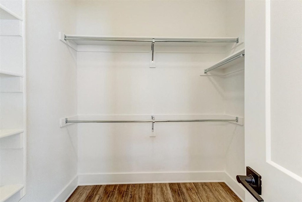 a walk in closet in a 555 waverly unit