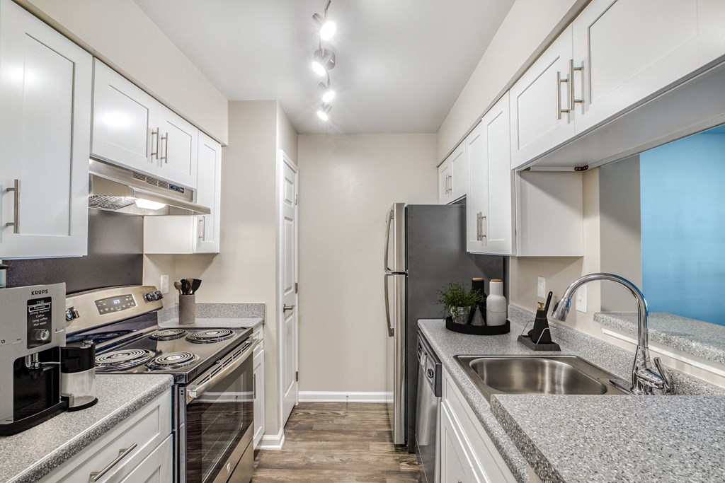 Kitchen with stainless-steel appliances at Artisan West in Houston, Texas