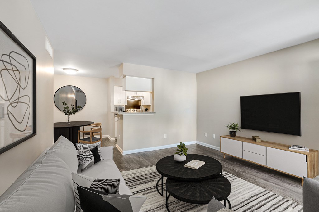 Open concept living room with kitchen view at Artisan West apartments near Westchase