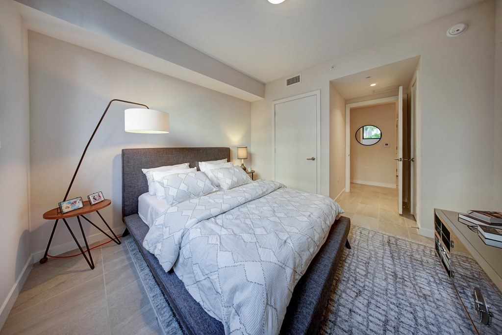 a bedroom with a large bed and a closet