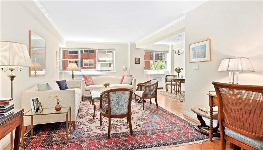 a living room with a couch and a chair