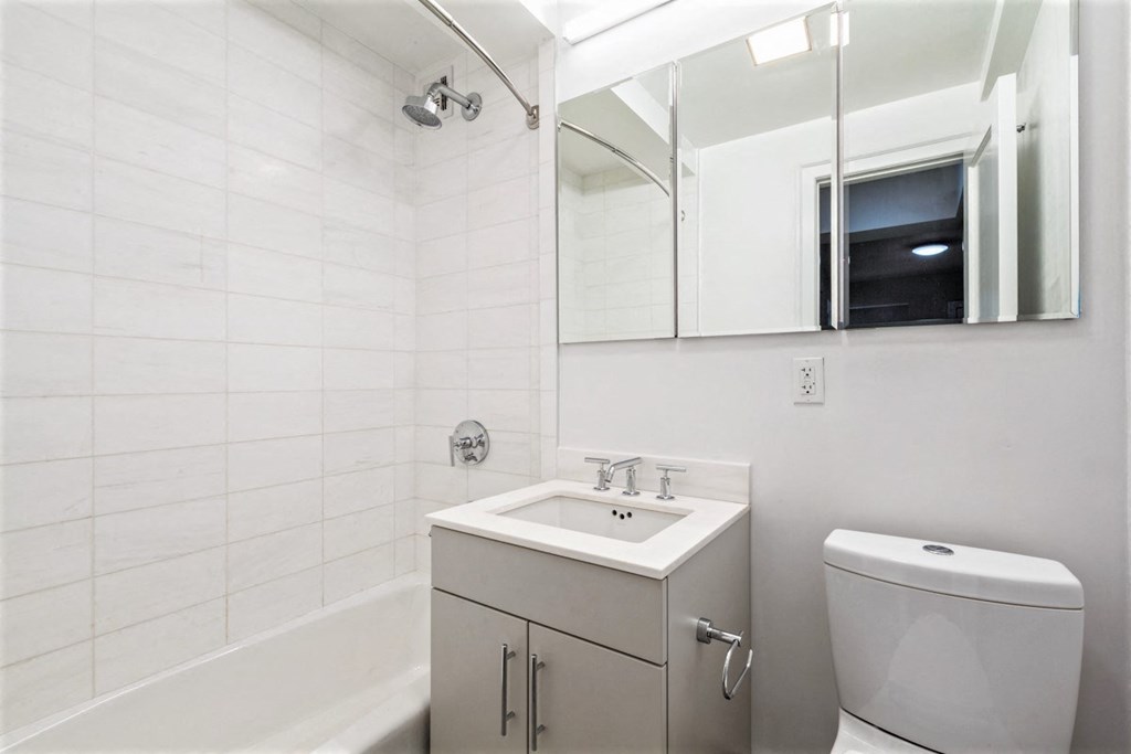a bathroom with a sink toilet and bathtub