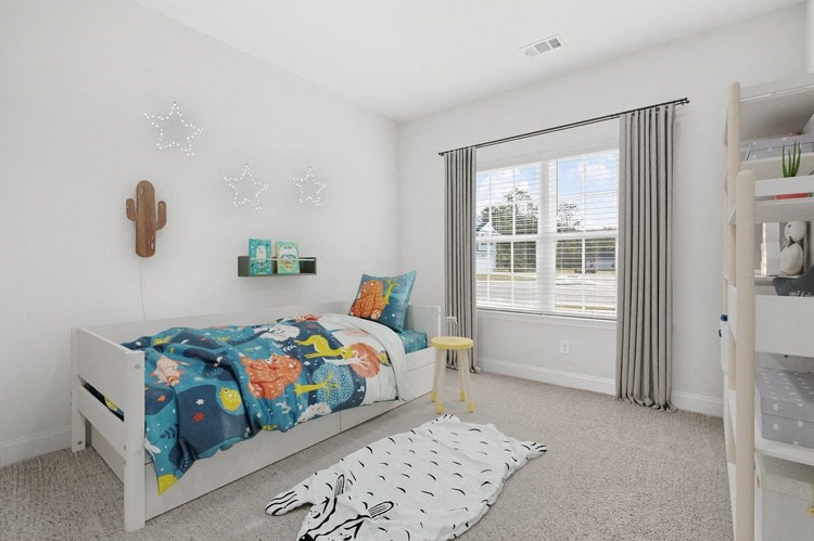 Harris Trail Luxury Townhomes for rent Richmond Hill, GA photo of a bedroom with a bed and a large window