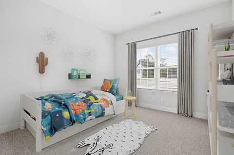 Harris Trail Luxury Townhomes for rent Richmond Hill, GA photo of a bedroom with a bed and a large window