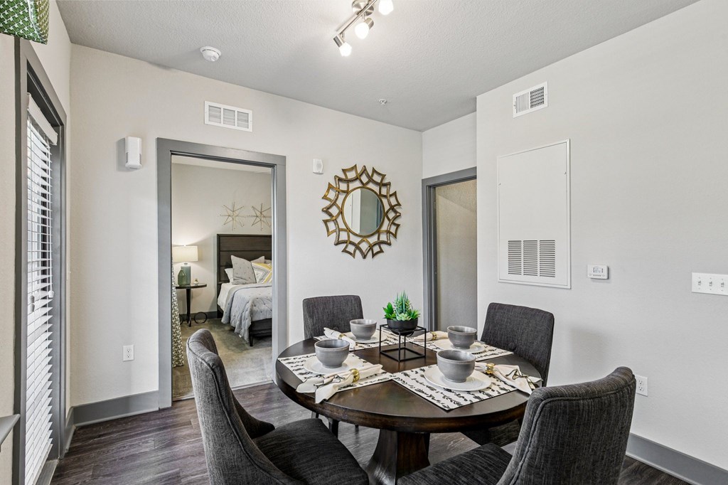 Cozy dining space with elegant lighting and modern furnishings at Lotus at Starkey Ranch in Odessa, Florida.