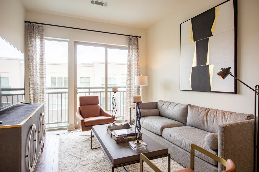 Apartments in Atlanta, GA for rent - Arabelle Perimeter - living room with a couch and a table