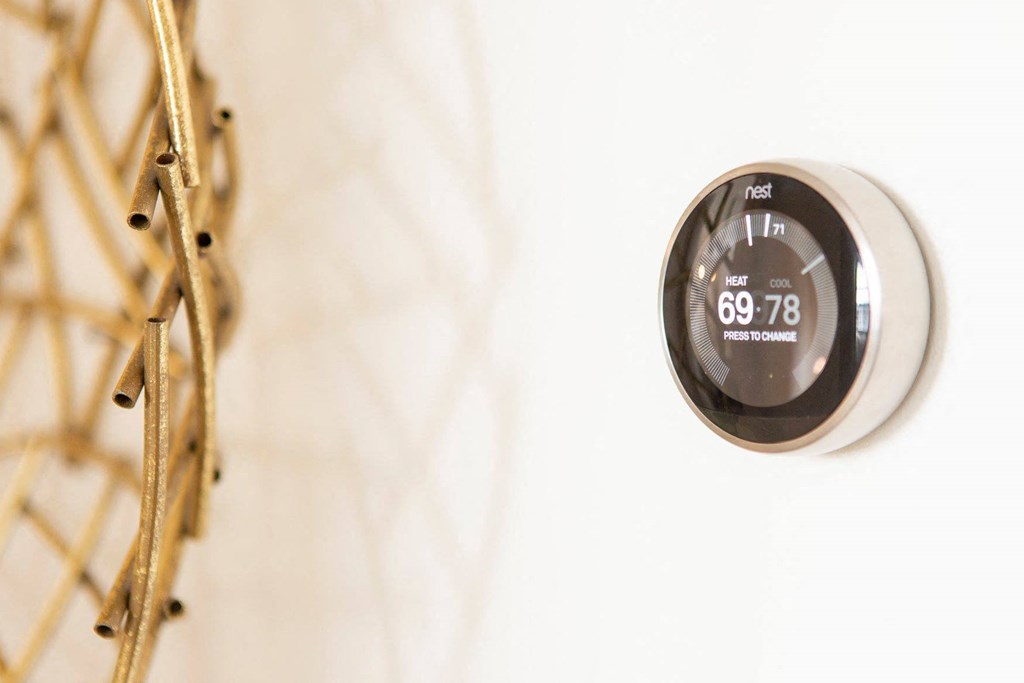 Apartments in Atlanta, GA for rent - Arabelle Perimeter - nest smart home thermostat on a wall next to a closet
