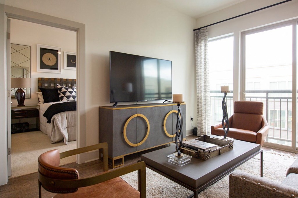 Apartments in Atlanta, GA for rent - Arabelle Perimeter - living room with a television on top of a tv stand