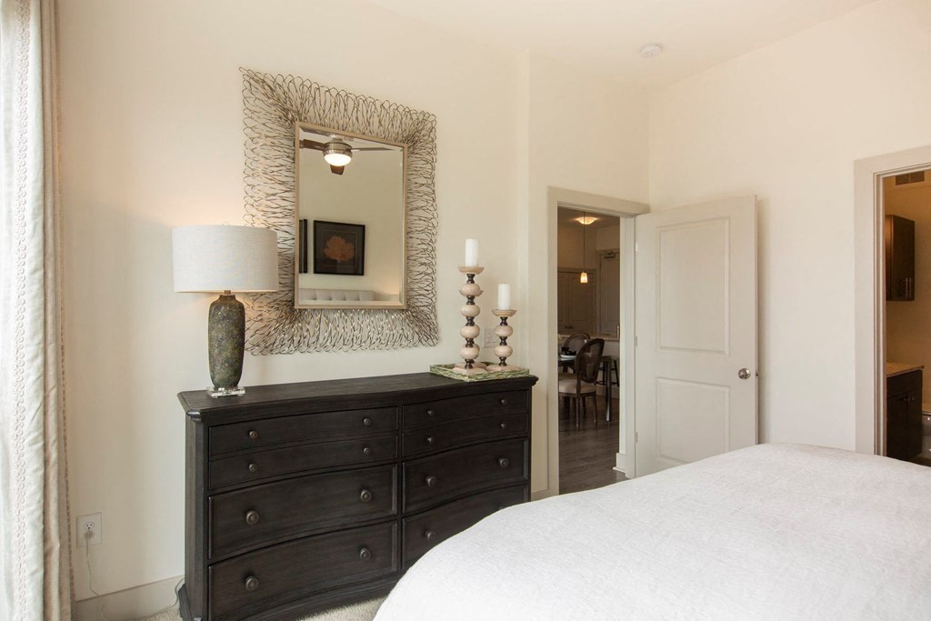 Apartments in Atlanta, GA for rent - Arabelle Perimeter - bedroom with a dresser and a mirror