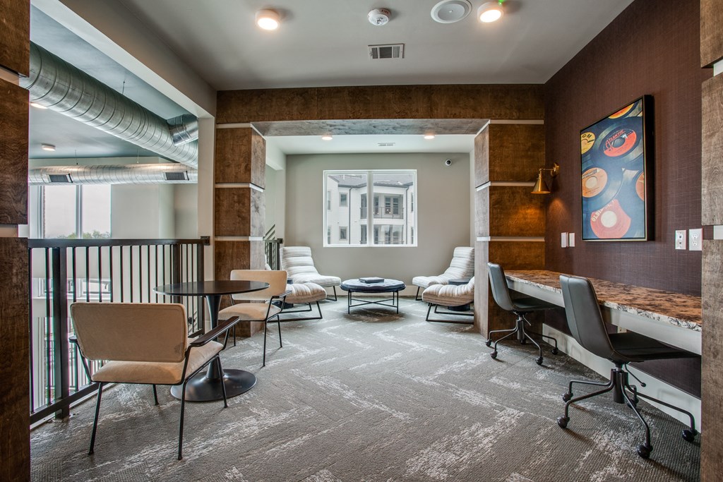 a lounge area with couches and chairs