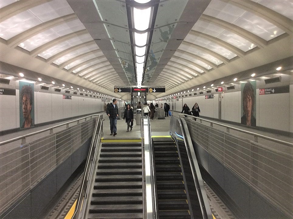 the escalator up to the subway in a subway station