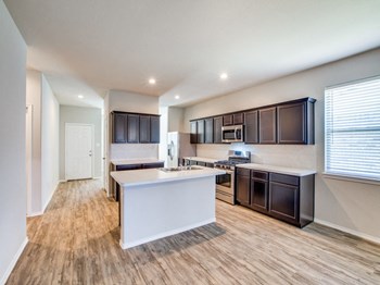 Wood Floor Kitchen Wood Floor Kitchen at Amber Pines at Fosters Ridge, Conroe, TX, 77384 - Photo Gallery 3