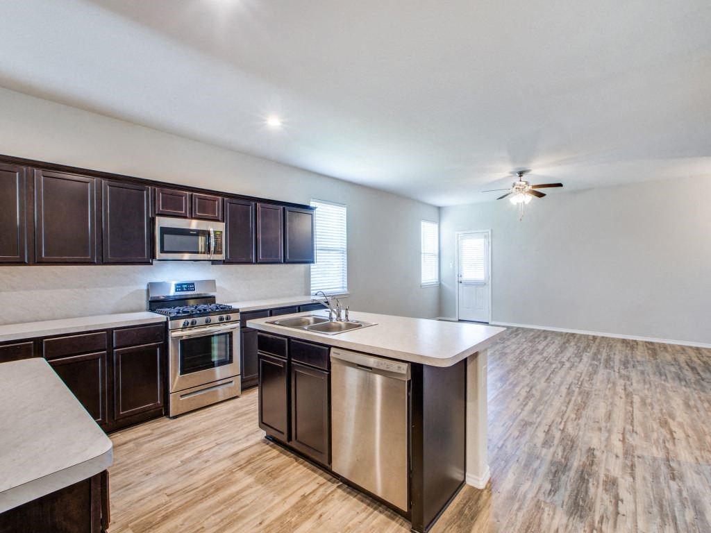 Sink With Faucet In Kitchen at Amber Pines at Fosters Ridge, Texas
