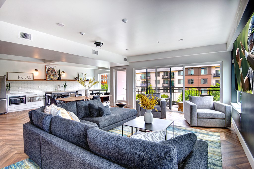 a living room with couches and chairs and a table