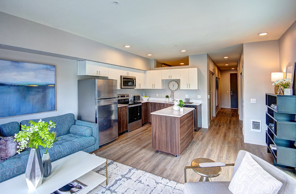 Bothell, WA Apartments for Rent - Open-Concept Kitchen with Wood Flooring, Stainless Steel Appliances, and Mobile Island