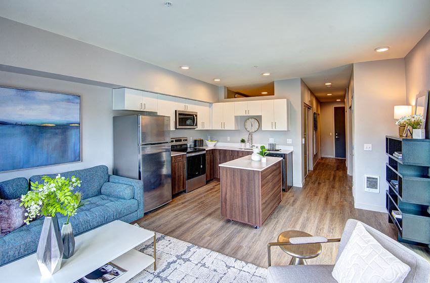 Bothell, WA Apartments for Rent - Open-Concept Kitchen with Wood Flooring, Stainless Steel Appliances, and Mobile Island - Photo Gallery