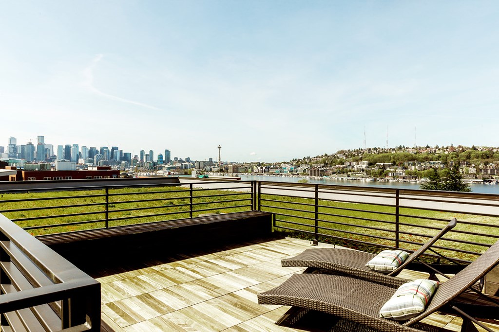 a deck with a view of the city and the water