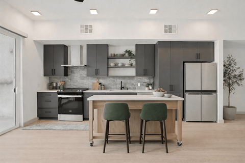 A modern kitchen with a table and chairs.