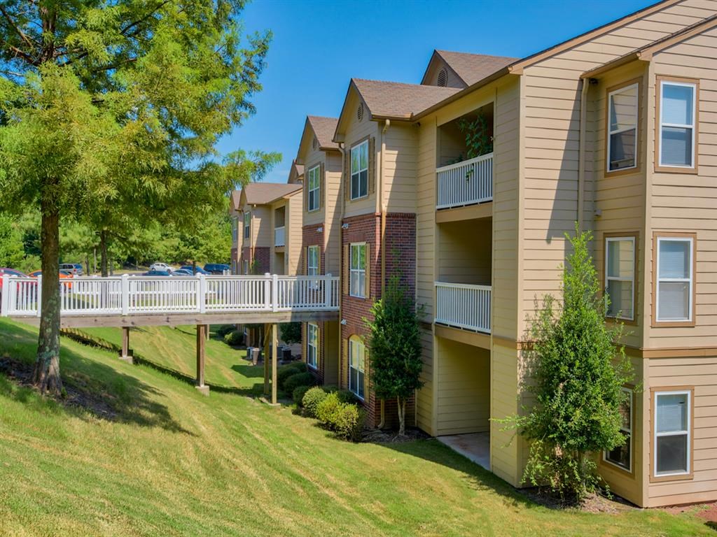 Outside photo of Capitol Hill apartments with bridge leading to complex