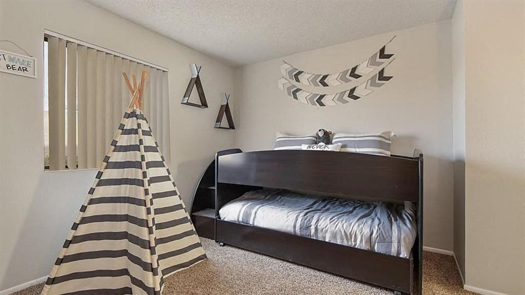 a bedroom with a bed and a tent in it