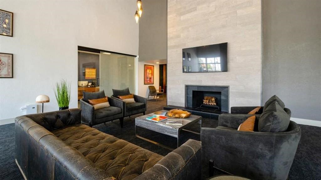 a living room filled with furniture and a fire place