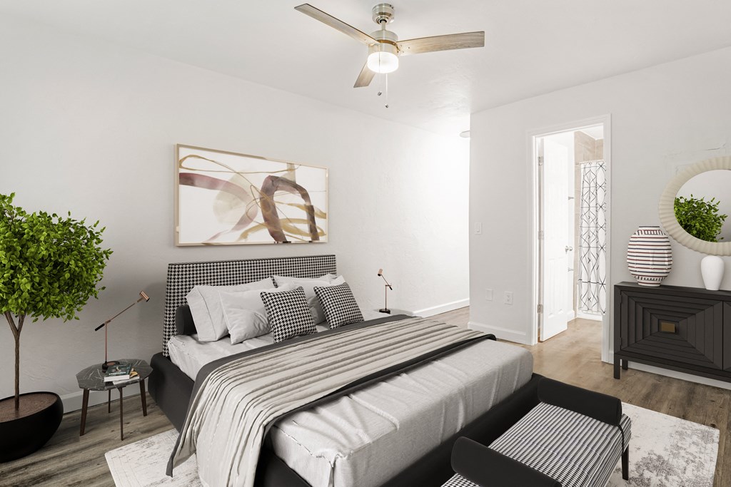 Addison Lane Apartment homes in Gainesville Florida photo of a bedroom with a bed and a ceiling fan