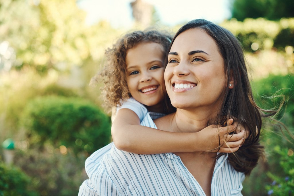 a woman holding a child in her arms