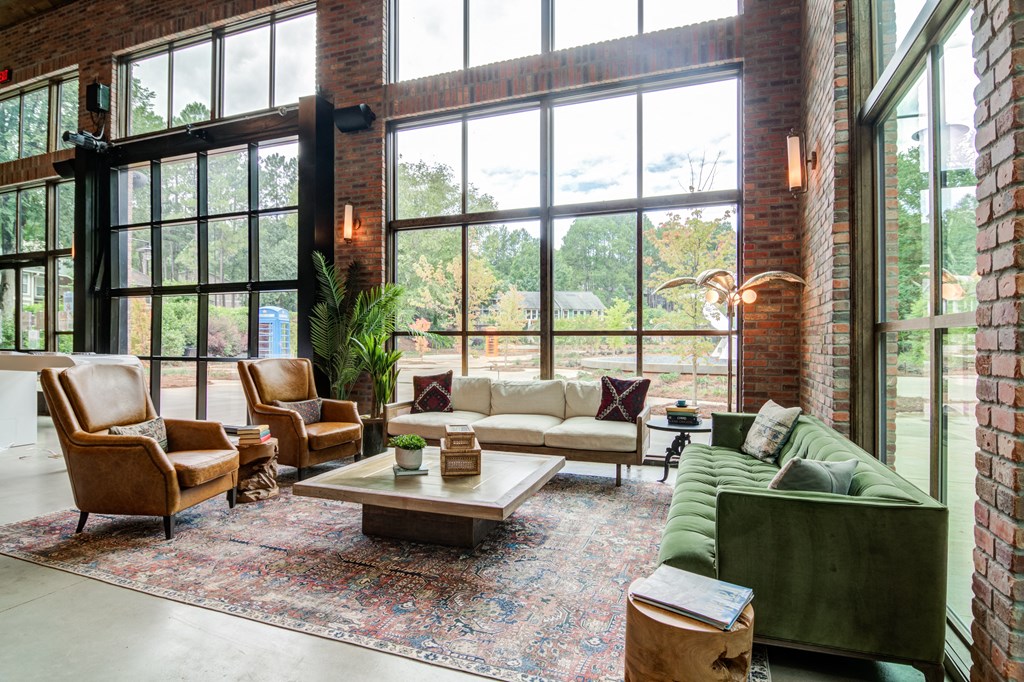Affinitee at Stone Mountain Apartments photo of seating area with large windows