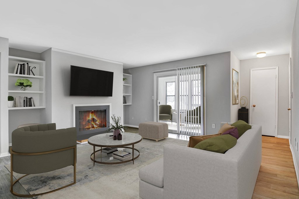 Affinitee at Stone Mountain Apartments photo of a living room with a couch and a chair and a fireplace