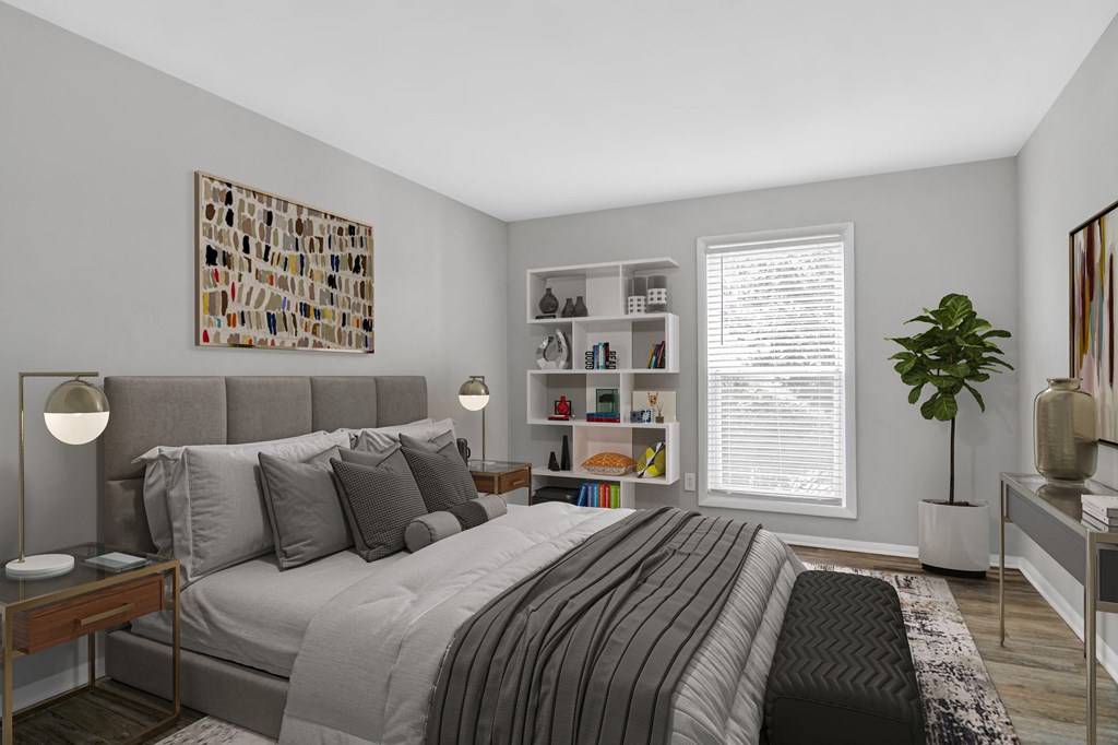 Affinitee at Stone Mountain Apartments photo of a bedroom with a large bed and a window